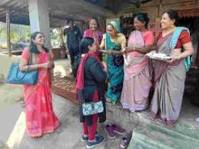 Picture of women gathered round talking to each other