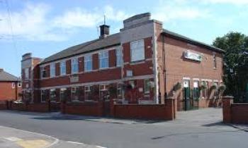 Picture of reddish mens club building