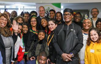 Staff and participants from Moss Side Millennium Powerhouse having a group photo with Prince William