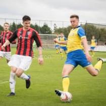 Two Boys playing football