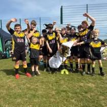 Kids rugby team celebrating